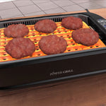 PowerXL Smokeless Grill – sechs Burger auf beleuchteter Grillfläche, gleichmäßige Hitzeverteilung sichtbar.