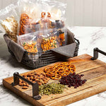 PowerXL Duo NutriSealer verpackt Snacks wie Nüsse und Brezeln portionsweise und luftdicht.