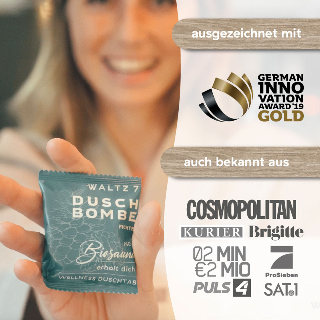 „Duschbombe wird in der Hand gehalten, daneben Logos des German Innovation Award und bekannter Medien wie Cosmopolitan, ProSieben und Puls4