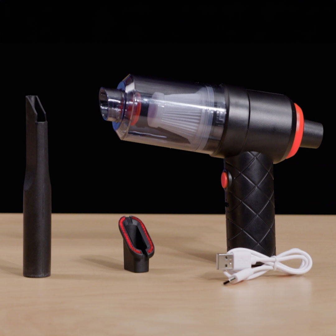 Handstaubsauger mit Zubehör: Fugendüse, Bürstenaufsatz, USB-Kabel.