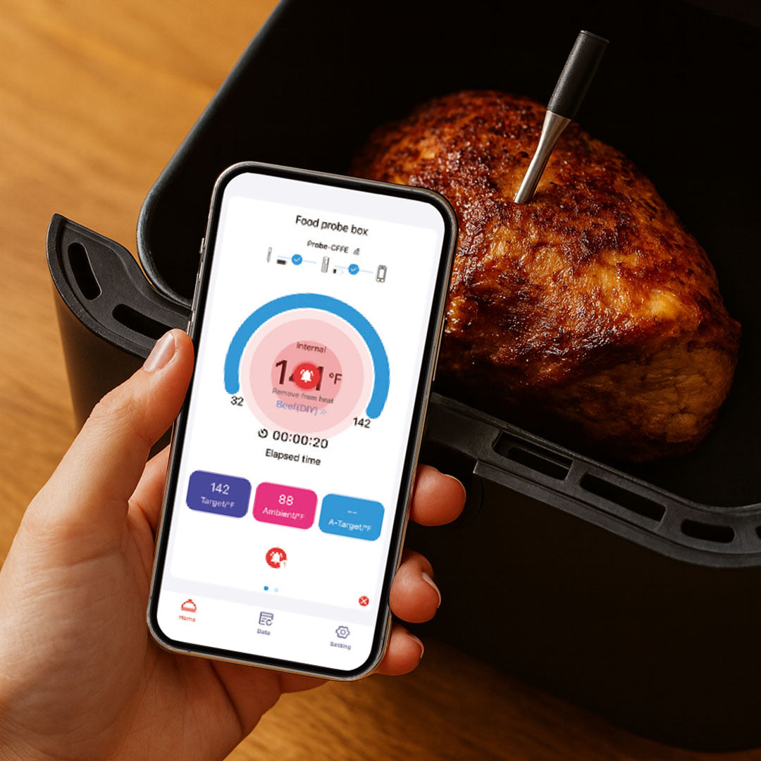 Smartphone zeigt Temperaturmessung über die SensoChef App während des Kochens an