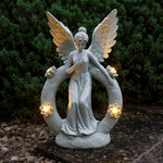 Solarleuchte Engel aus Kunststein mit LED-Blumenbeleuchtung für Außenbereiche.